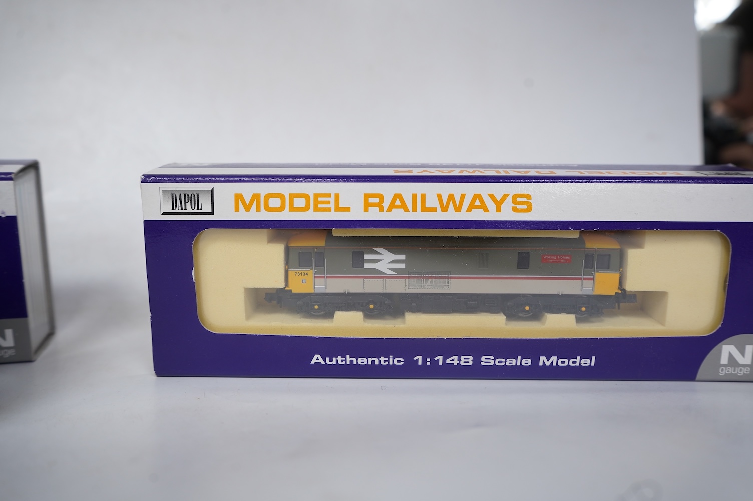 Three boxed Dapol N gauge railway Class 73 electro-diesel locomotives; 73109 Battle of Britain (ND006), 73114 Stewarts Lane (ND-021a) and 73134 Woking Homes (ND-007). Condition - good.